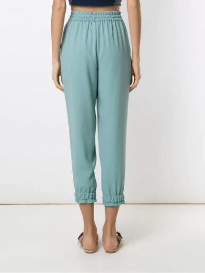 Shop Martha Medeiros Crepe Tapered Trousers In Green