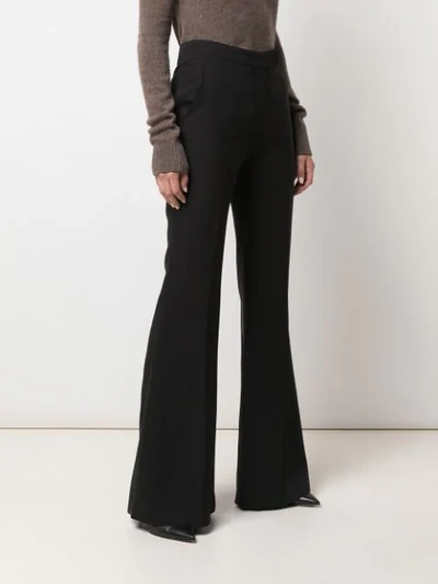 Shop Gabriela Hearst High-rise Flared Trousers In Black