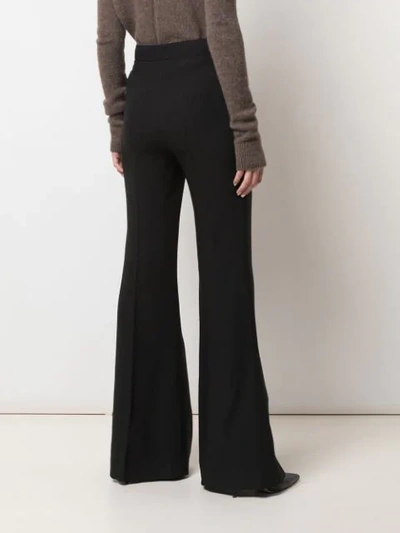Shop Gabriela Hearst High-rise Flared Trousers In Black