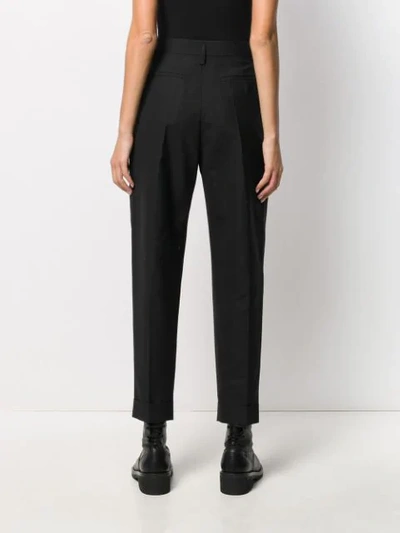Shop Ann Demeulemeester Tapered Pleat Trousers In Black