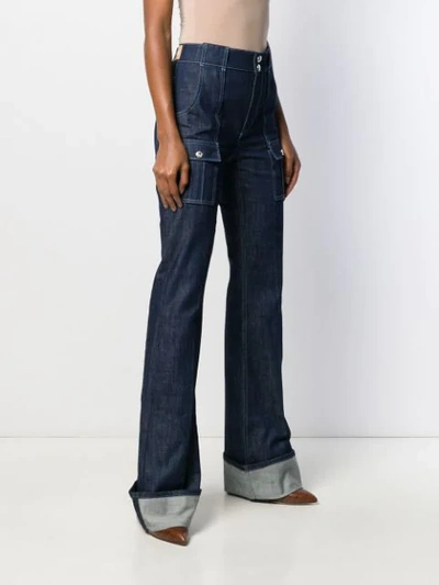 Shop Chloé Patch Pockets Flared Jeans In Blue