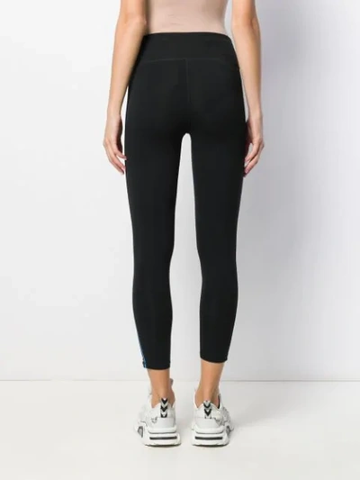 Shop Dkny Side Stripe Leggings In Black