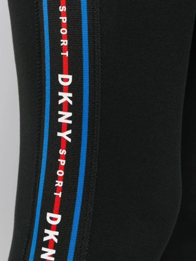 Shop Dkny Side Stripe Leggings In Black