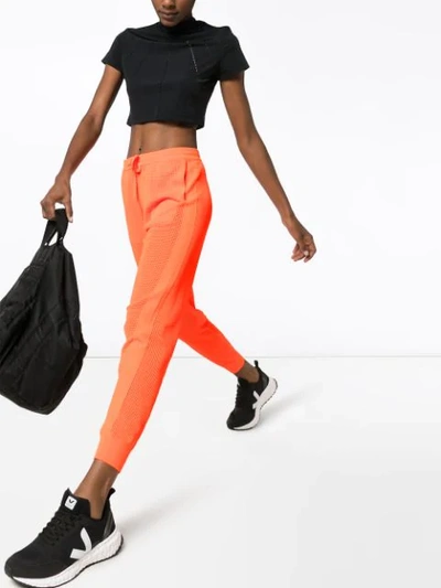 Shop Adam Selman Sport Mid-rise Mesh Track Pants In Orange