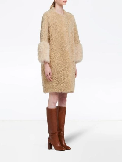 Shop Prada Fur Cuff Teddy Coat In Brown