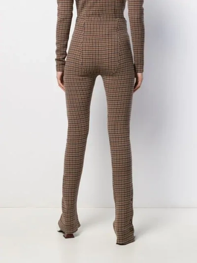 Shop A.w.a.k.e. Flared Check Trousers In Beige/brown