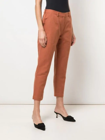 Shop Apiece Apart High-waisted Tapered Trousers In Orange