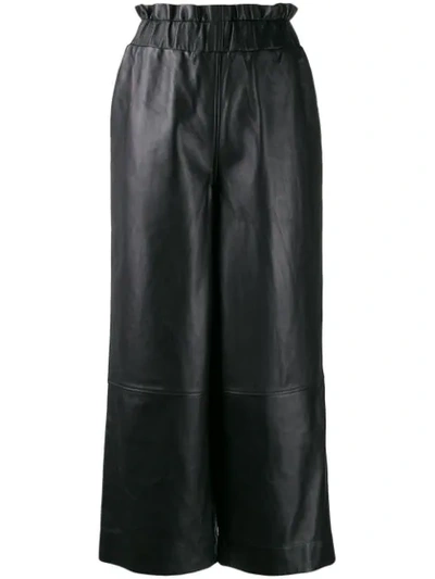 Shop Ganni Wide-leg Leather Trousers In Black