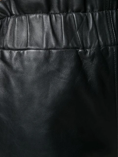 Shop Ganni Wide-leg Leather Trousers In Black