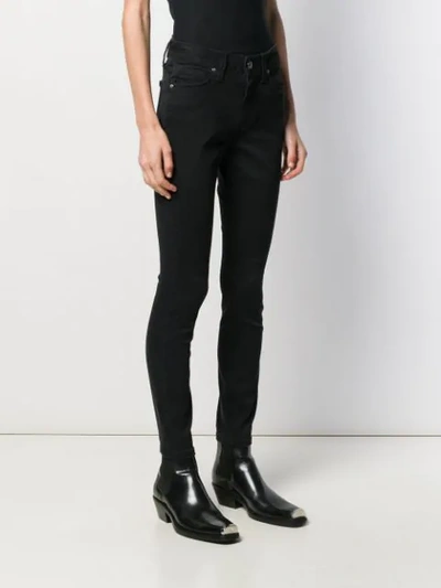 Shop Calvin Klein High Rise Skinny Jeans In Black