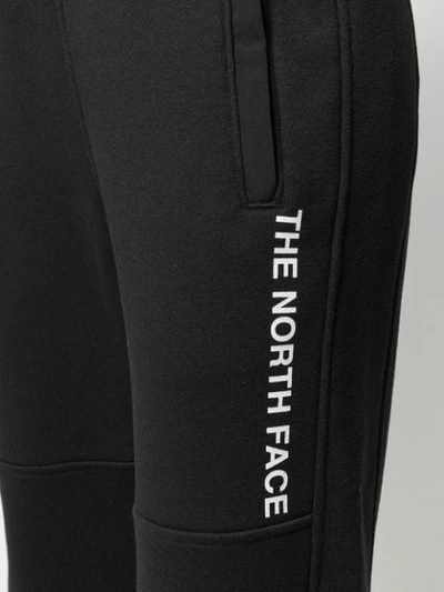 Shop The North Face Printed Logo Track Pants In Black