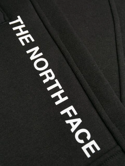 Shop The North Face Printed Logo Track Pants In Black