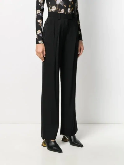 Shop Michael Michael Kors Flared Logo Jacquard Trousers In Black