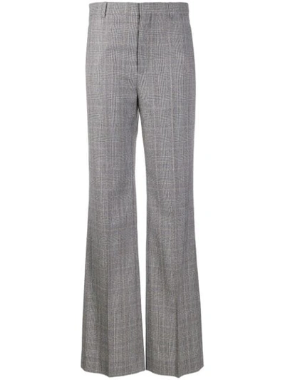 Shop Balenciaga Flared Checked Trousers In Black