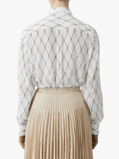 Shop Burberry Crystal Detail Net Print Silk Oversized Tie-neck Shirt In White