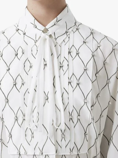 Shop Burberry Crystal Detail Net Print Silk Oversized Tie-neck Shirt In White