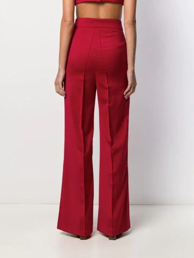 Shop Atu Body Couture High Waisted Flared Trousers In Red