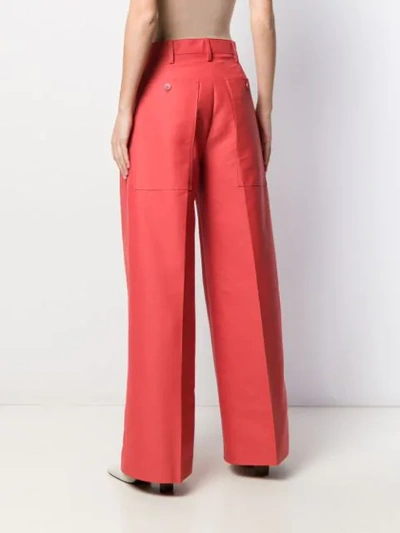 Shop Jacquemus Pleated Details Palazzo Trousers In Orange
