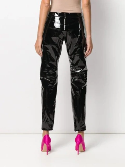 Shop Saint Laurent Patent Tapered Trousers In Black