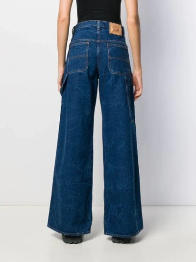 Shop Aries Flared Style Jeans In Blue