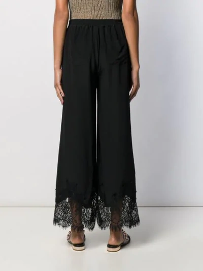 Shop Gold Hawk Lace Hem Wide-leg Trousers In Black