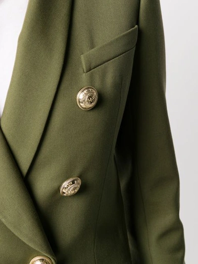 Shop Balmain Embossed Buttons Blazer In Green