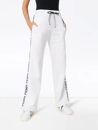 Shop Fendi Wide-leg Logo Stripe Track Pants In White
