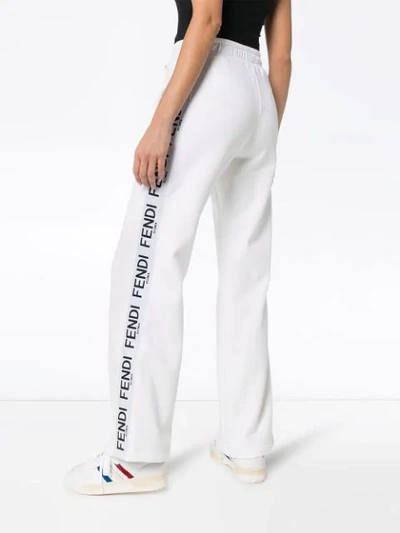 Shop Fendi Wide-leg Logo Stripe Track Pants In White