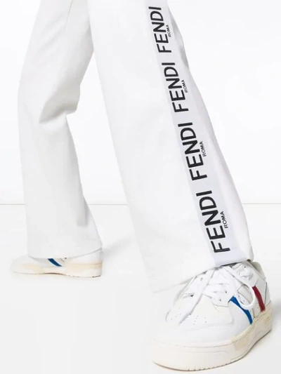 Shop Fendi Wide-leg Logo Stripe Track Pants In White