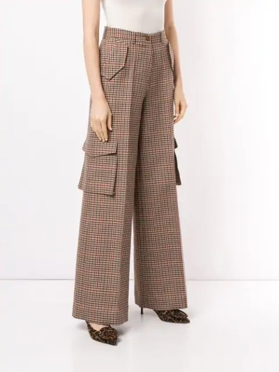 Shop Bouguessa Check Print Cargo Trousers In Brown