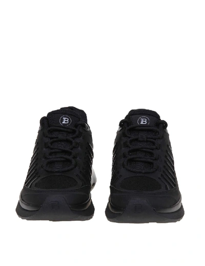 Shop Balmain B-trail Sneakers In Leather And Black Fabric