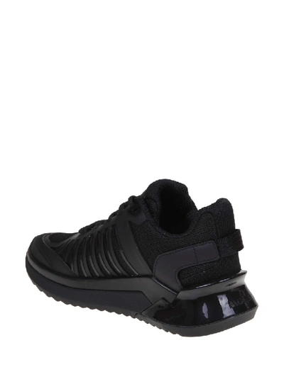 Shop Balmain B-trail Sneakers In Leather And Black Fabric