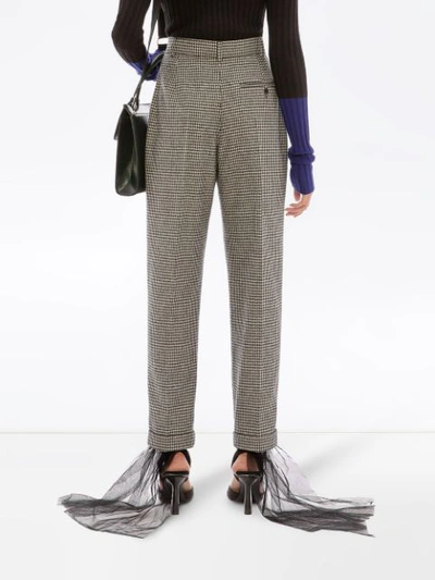 Shop Jw Anderson Houndstooth Carrot Trousers In Blue
