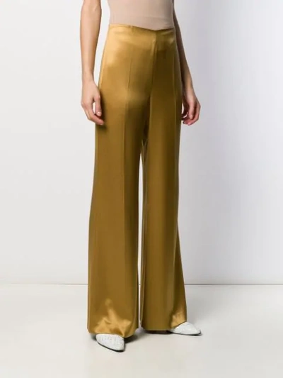 Shop Joseph Devyn Flared Silk Trousers In Gold