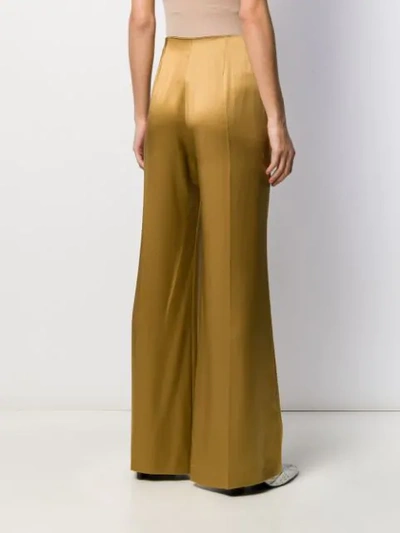 Shop Joseph Devyn Flared Silk Trousers In Gold