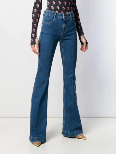 Shop Stella Mccartney Stellabration Print Flared Jeans In Blue