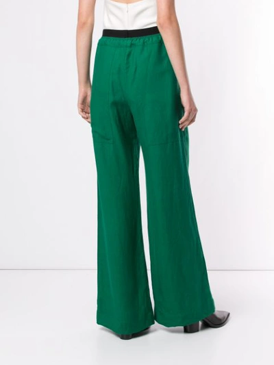 Shop Taylor Fluency Flared Trousers In Green