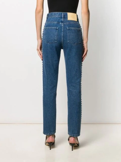 Shop Christopher Kane Embellished Side-stripe Jeans In Blue