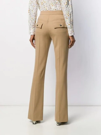 Shop Chloé High-rise Flared Trousers In Brown