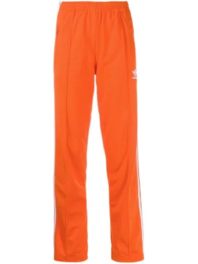 Shop Adidas Originals Logo Printed Track Pants In Orange