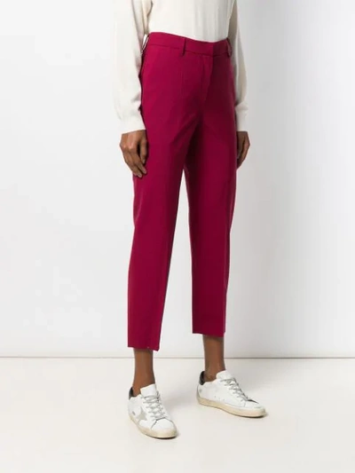 Shop Brunello Cucinelli Tapered Ankle Trousers In Red