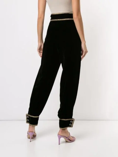 Shop Gucci Bejeweled Tapered Trousers In Black