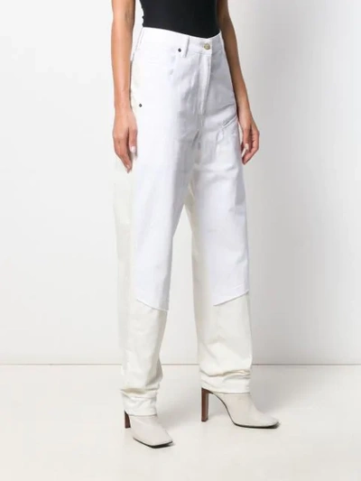 Shop Jacquemus Layered High Waist Jeans In White