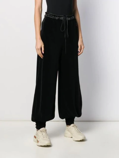 Shop Gucci Tapered Wide-leg Trousers In Black