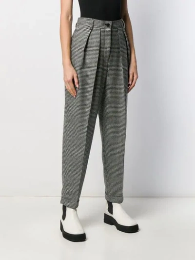 Shop Jw Anderson Check Pattern Trousers In Black