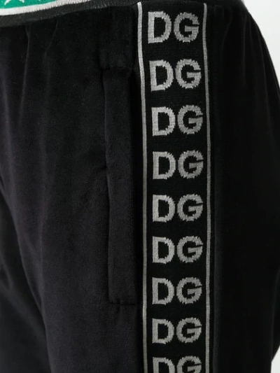 Shop Dolce & Gabbana Cuffed Logo Stripe Track Pants In Black