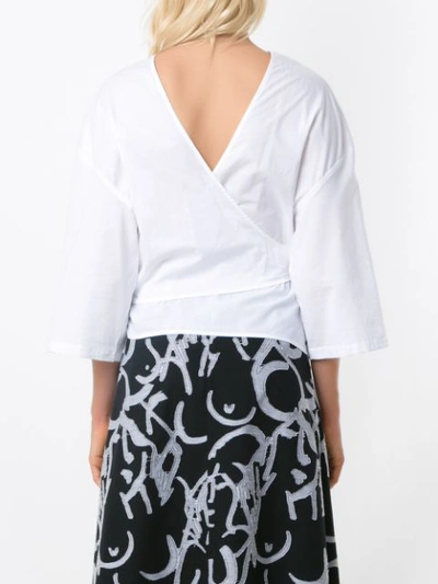 Shop Andrea Marques Belted Wrap Blouse In White