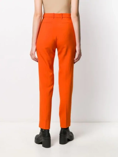 Shop Gucci High-rise Tapered Trousers In Orange