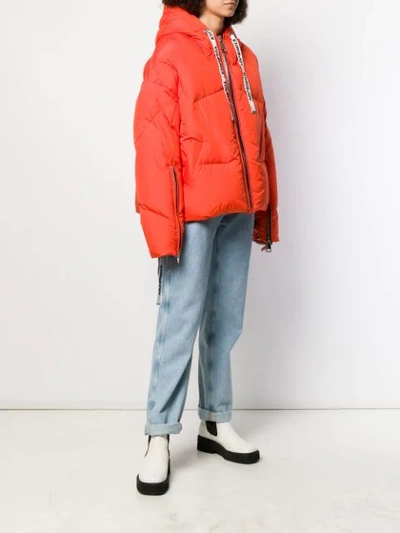 Shop Khrisjoy Oversized Padded Jacket In Orange