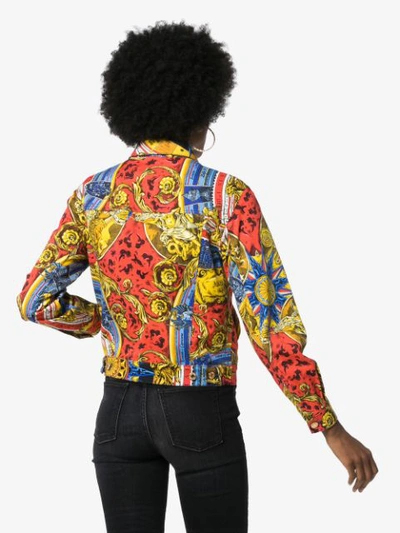 Shop Moschino Printed Denim Jacket In Red